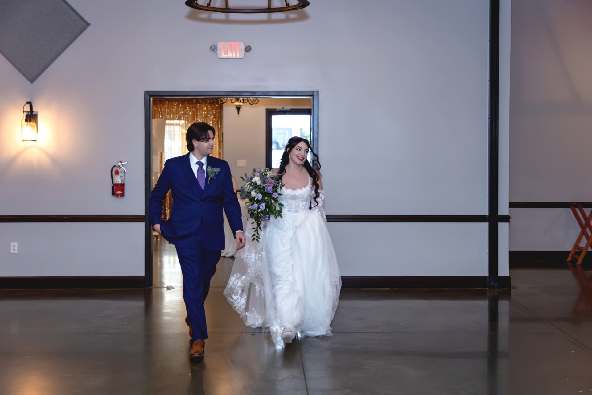 Tristan and Maddie entering the reception room