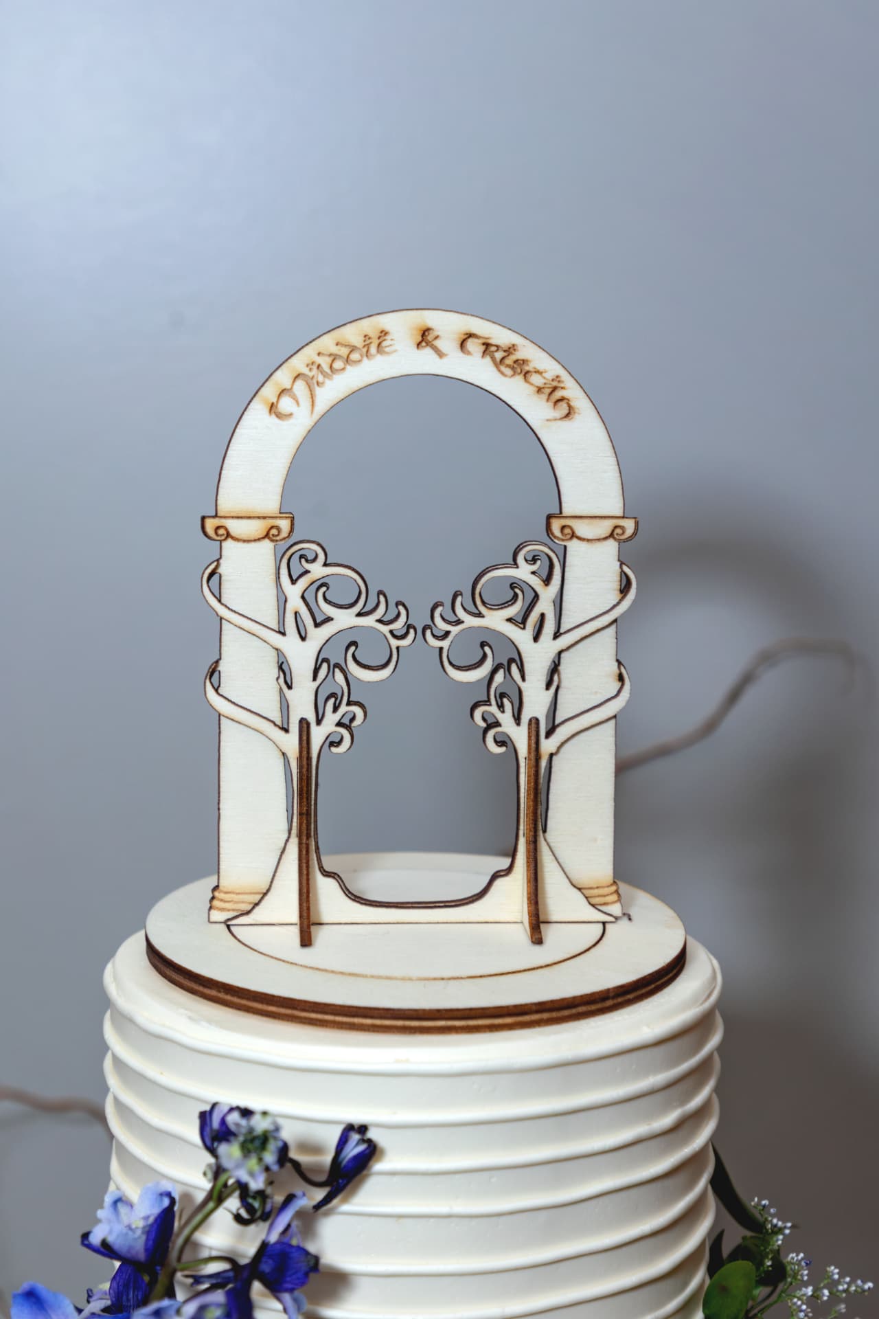 Wedding cake topped with a miniature couple